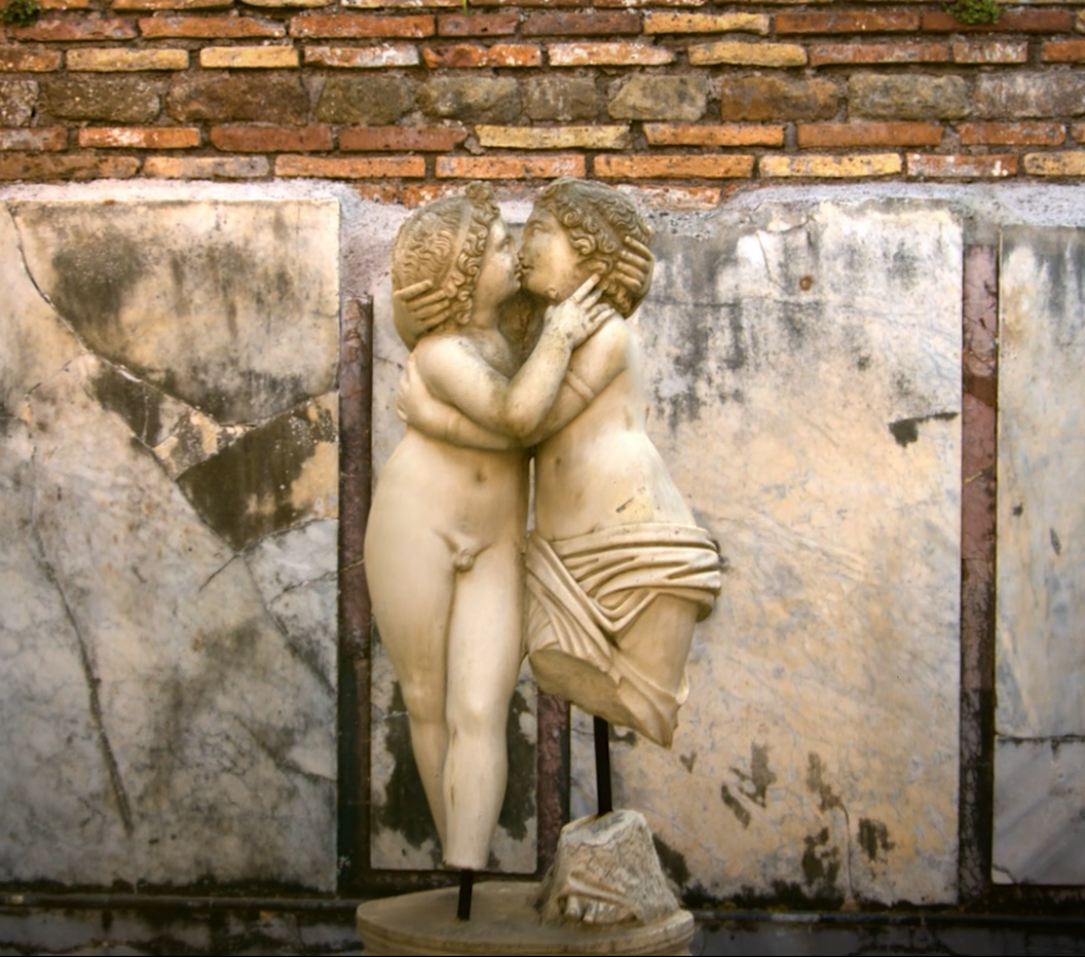 Statue of two figures, nude and semi-nude, embracing