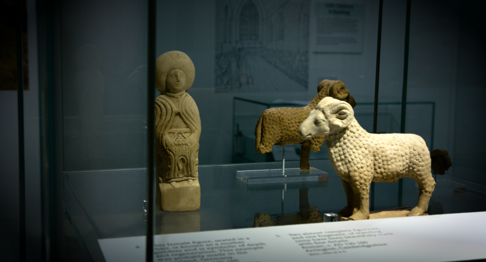 Figurines of a seated woman and of rams